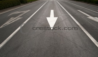 Arrow sign on road