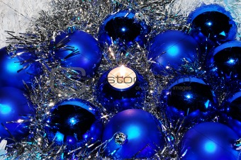 Blue Christmas baubles and a candle