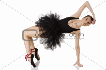 ballerina in black stretching 