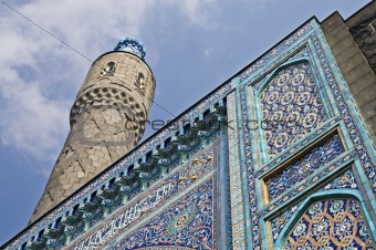 The minaret and the front wall with Arabic mosaics of the ancien