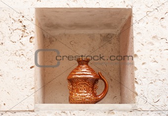 Handmade earthenware in wall niche