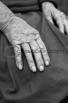 Old woman hands with wrinkled skin