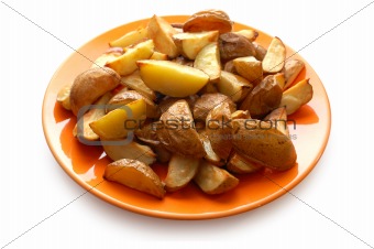 Potatoes baked in their jackets on orange plate