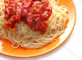 Spaghetti with meat in ketchup on orange plate