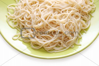 Italian spaghetti on green plate