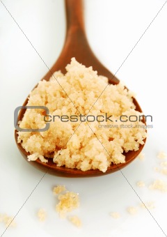 bath salt on a wooden spoon closeup 