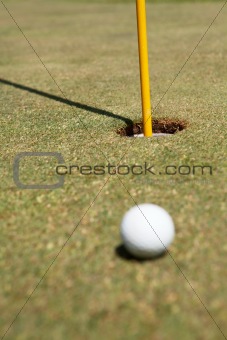 Golf ball laying on the green