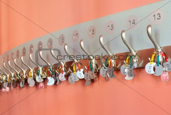 Coat hooks with keys organized in a row