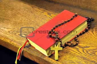 Hymnal  book and wooden rosary bead- detail