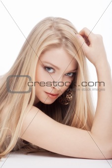 portrait of a young beautiful blond woman with blue eyes - isolated on white