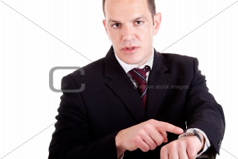 upset businessman pointing to the watch, isolated on white background. Studio shot.