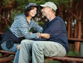 Middle-age couple sitting on a bench