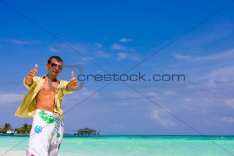 Young man with thumb up