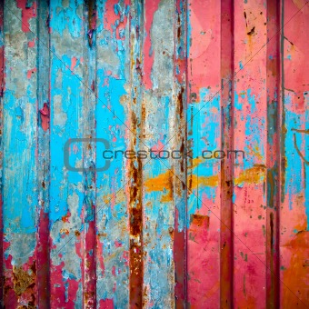 Red and blue color paint on metal wall