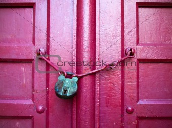 Green Key on Red Wood Door