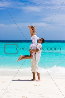 Happy young couple on a beach