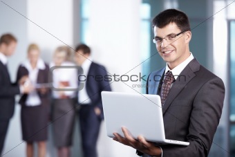 Man with laptop in the office