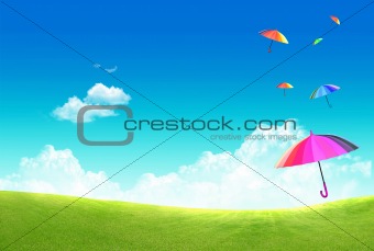 Multicolor umbrella floating in the sky
