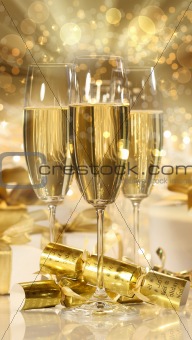 Glasses of champagne and gifts for new years