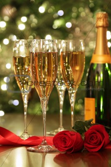 Glasses of Champagne with red roses