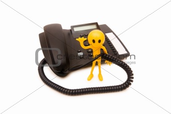 Phone support concept  - smilie and telephone isolated on white