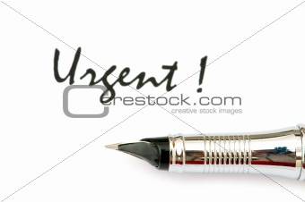 Pen and urgent message  - focus on the pen