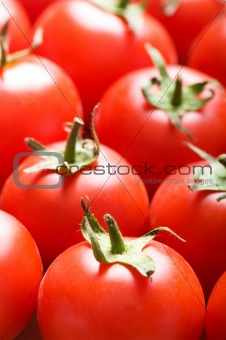 Red tomatoes arranged at the market stand