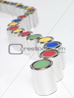 Colored paint cans in a row