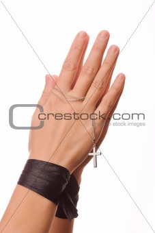 Woman is praying holding the cross