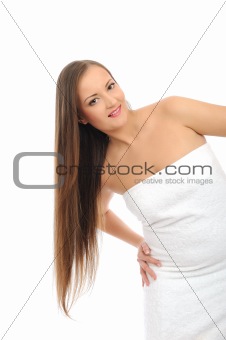 Beautiful spa woman with long healthy hair in white bath towel.