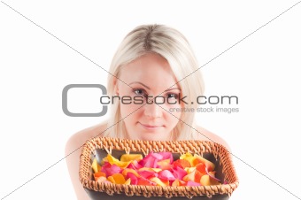 Woman and petals on the plate
