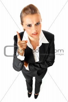 Full length portrait of strict modern business woman shaking her finger

