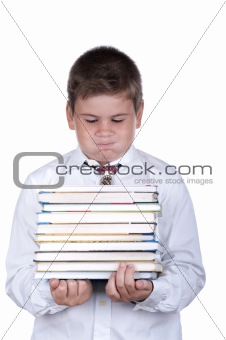 Boy holds heavy books