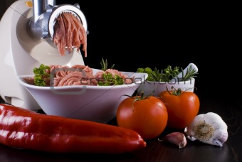 Meat grinder with mince and vegetables