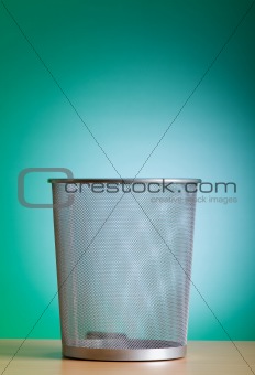 Garbage bin with paper waste isolated on white 