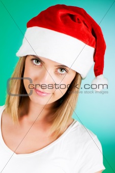 Girl with santa hat against gradient background