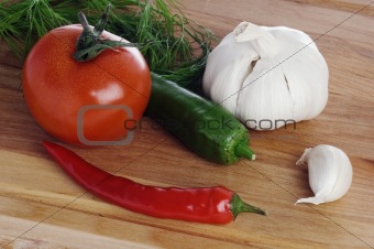  vegetables  on a wooden kitchen board