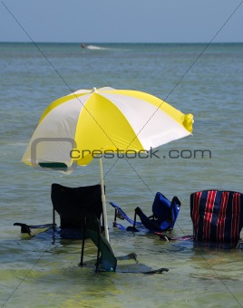 Sinking umbrella and chairs