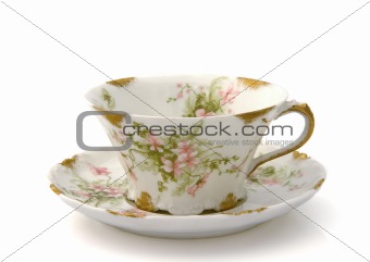 Antique Teacup and Saucer on White