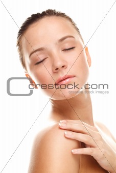 Beautiful young woman touching her skin.