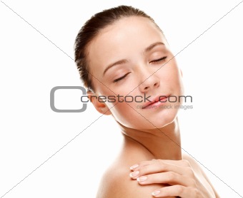 Beautiful young woman touching her skin.