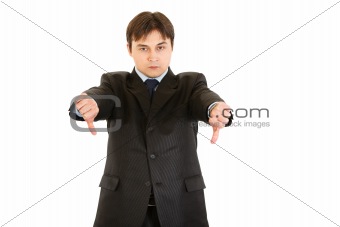 Displeased modern businessman showing thumbs down gesture
