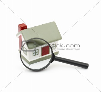 magnifying glass examining model home