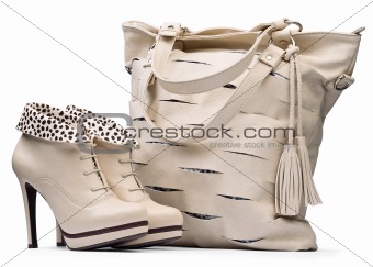 Creamy female boots and leather bag