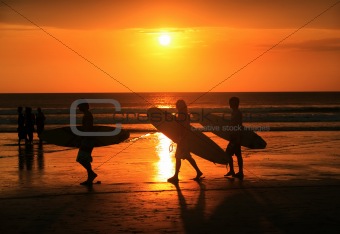 Surfers on sunset