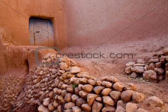 A pink narrow street in a village of Africa