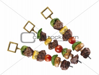 pork shish kebab with vegetables isolated on white
