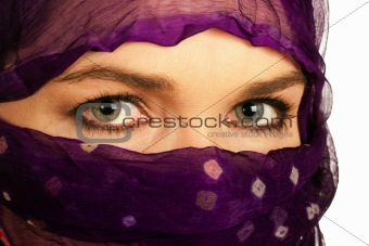 Beautiful Indian or Asian woman wearing a purple veil