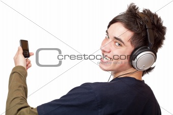 Teenager with headphone and mp3 player enjoys music