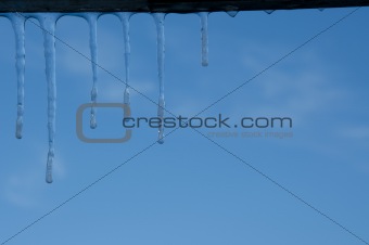 Icicles in blu sky